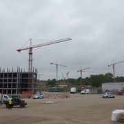 Quiet UK construction site with cranes and workers