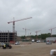 Quiet UK construction site with cranes and workers