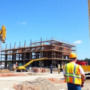 Construction site with machinery and workers.