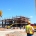 Construction site with machinery and workers.