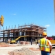 Construction site with machinery and workers.