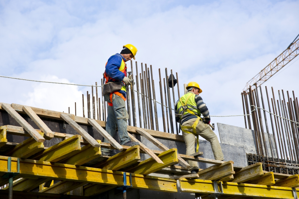 Construction workers preparing for office redevelopment on Shaftesbury Avenue, London.