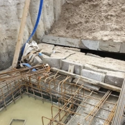 Collapsed wall at construction site, injured worker.