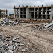Empty construction site under grey skies, showing decline.