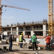 Construction site with cranes and workers in the Midlands.