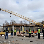 Collapsed tower crane jib on a construction site.